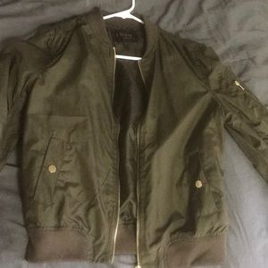 Army green bomber jacket with gold zippers